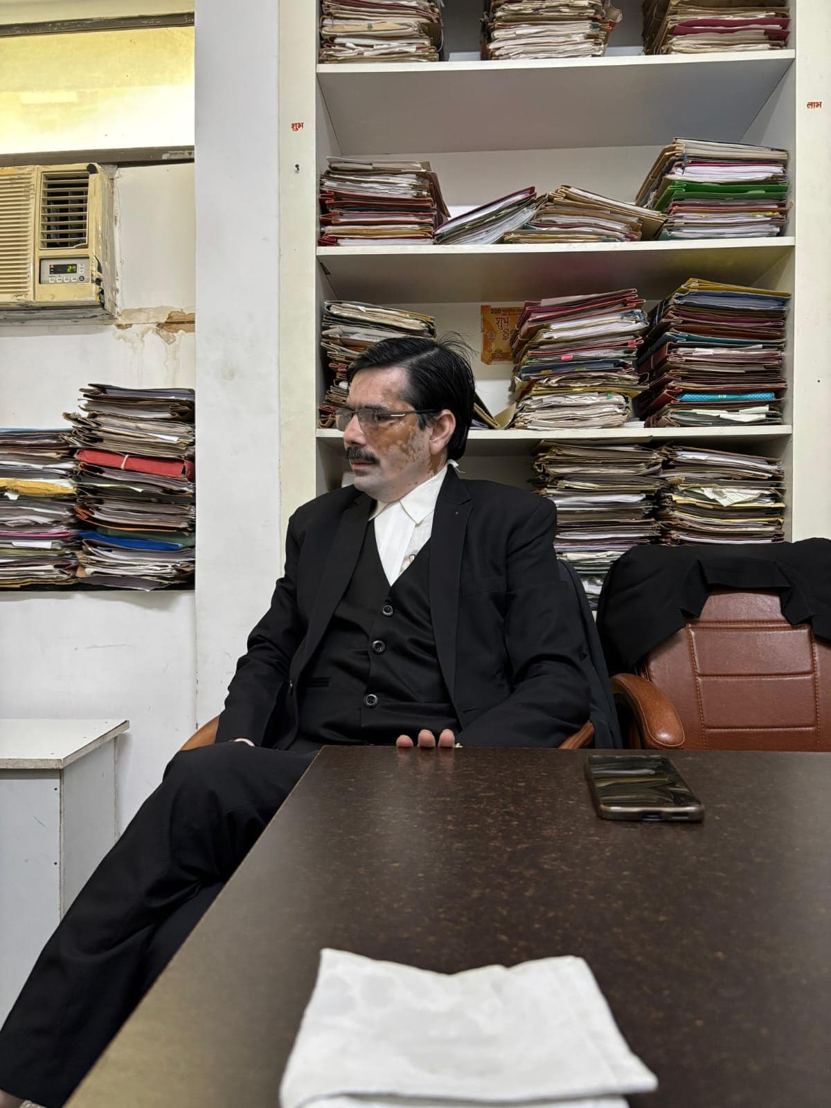Arbind Kumar Srivastava Seated at Legal Conference Desk