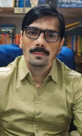 Arbind Kumar Srivastava Executive Headshot in Office